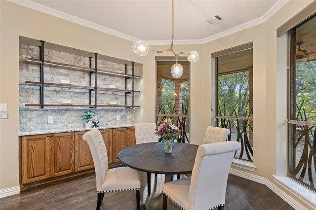a view of a dining room with furniture window and outside view