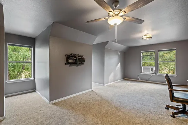 a view of livingroom with window ceiling fan and hardwood floor