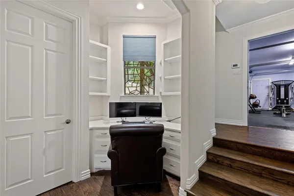 a view of a livingroom with furniture and a flat screen tv