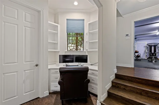 a view of a livingroom with furniture and a flat screen tv