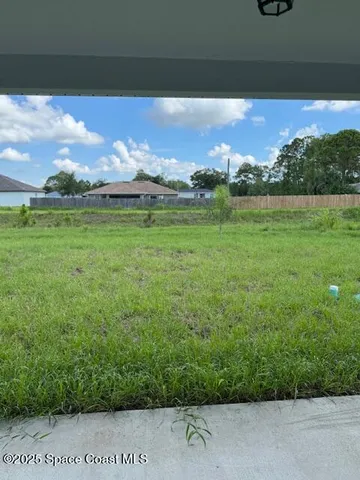 a view of yard with outdoor seating