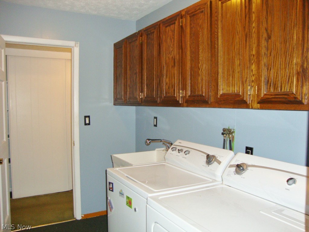 5698 Rock Point Circle North Ridgeville, OH 44039 - Photo 20 of 25 The laundry room is carpeted and includes a laundry tub. Washer and dryer stay and are approximately 3 years old.