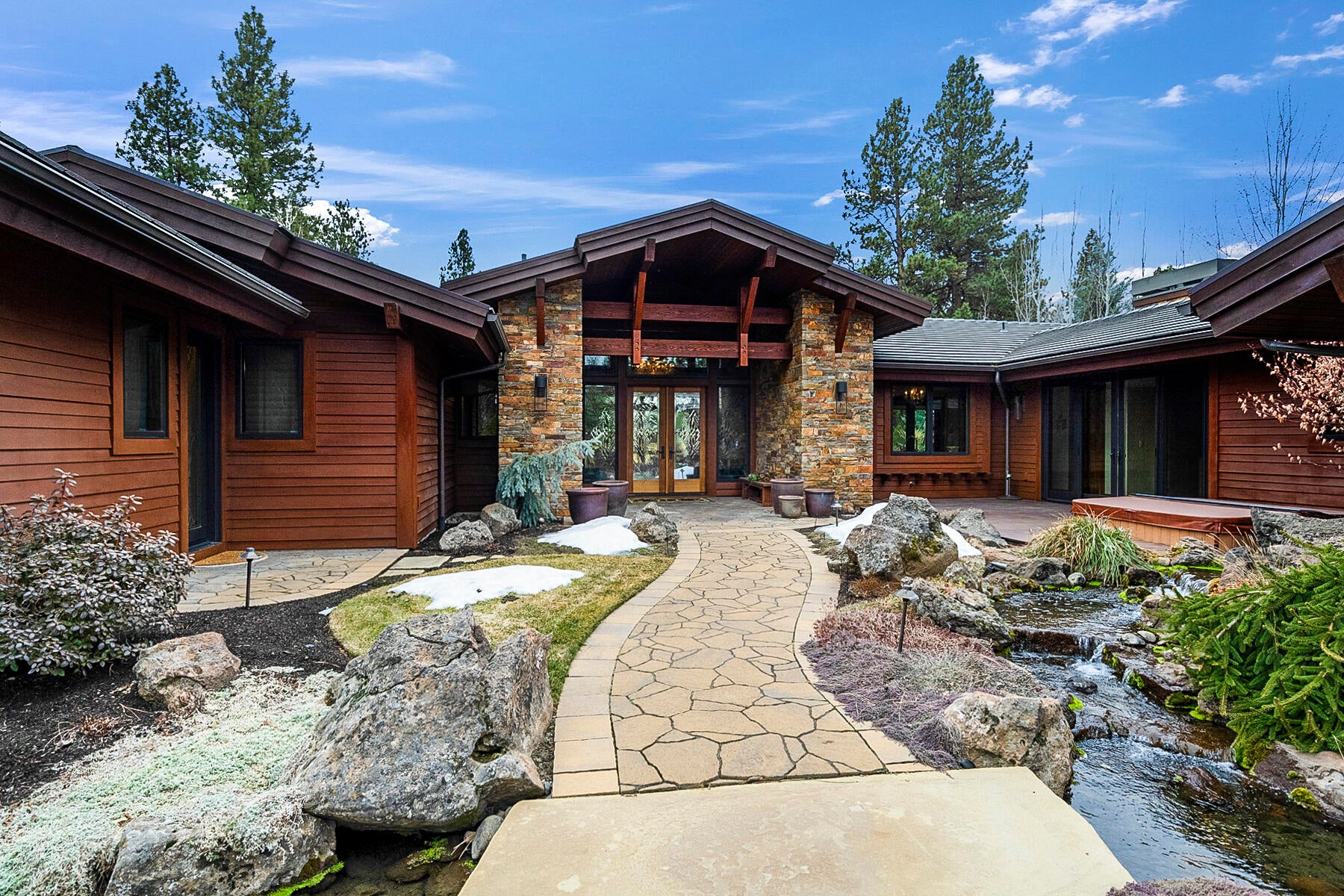 19442 Green Lakes Loop Bend, OR 97702 - Photo 5 of 50 Private courtyard with Cascading water feature & patio with hot tub.