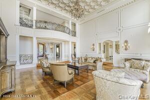 50 Wakefield Staten Island, NY 10312 - Photo 16 of 48 a living room with furniture and a chandelier