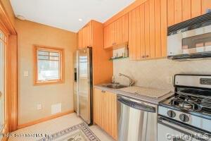 50 Wakefield Staten Island, NY 10312 - Photo 18 of 48 a kitchen with a stove and a window