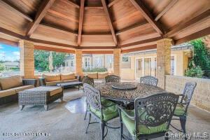 50 Wakefield Staten Island, NY 10312 - Photo 48 of 48 a dining room with furniture a rug and a large window