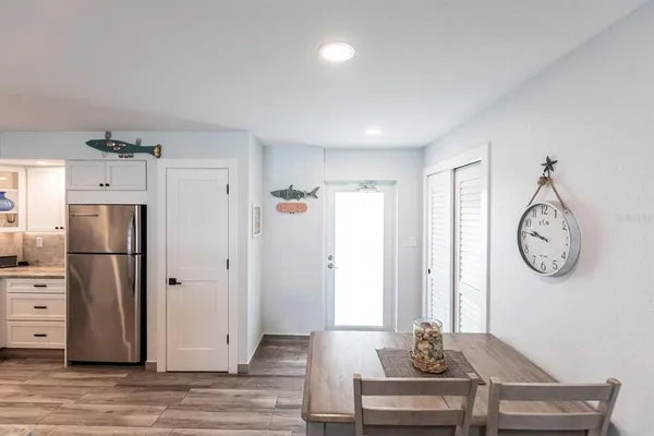 a view of a room with wooden floor