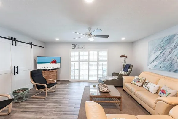 a living room with furniture and a window