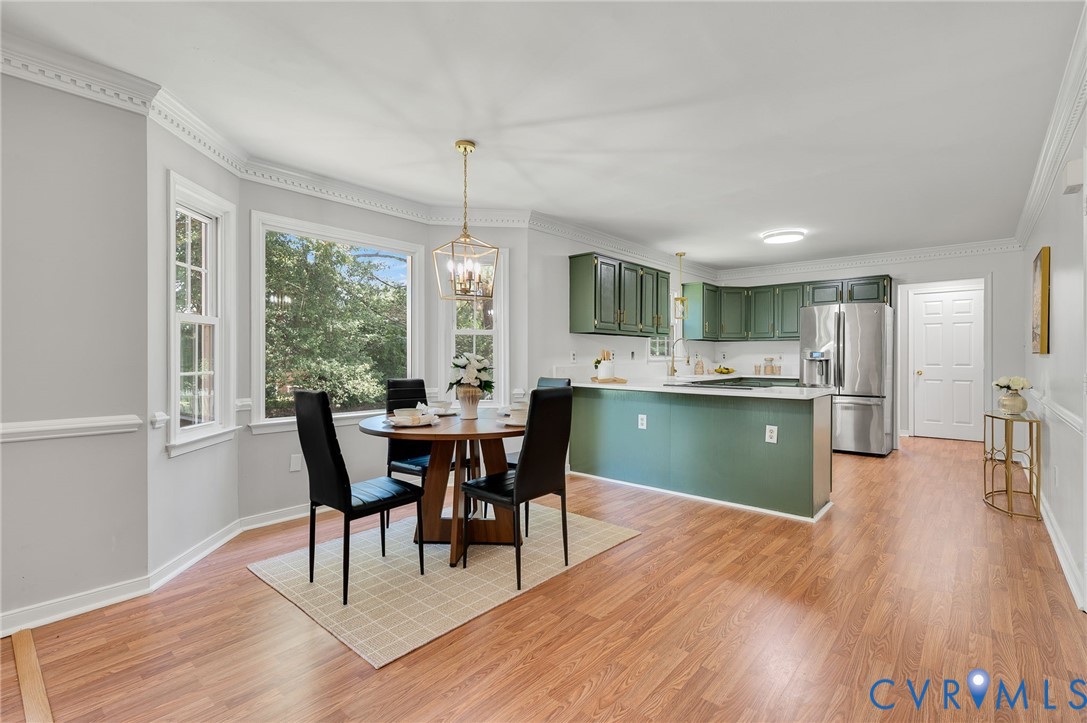 10110 Holly Road Mechanicsville, VA 23116 - Photo 11 of 26 Open-concept dining and kitchen area featuring woo