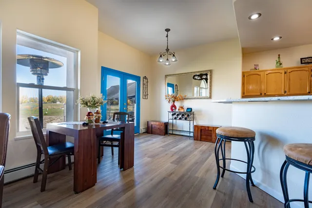 a view of a dining room with furniture window and wooden floor