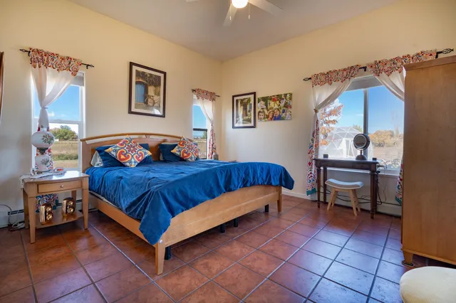 a bedroom with a bed and a table in it