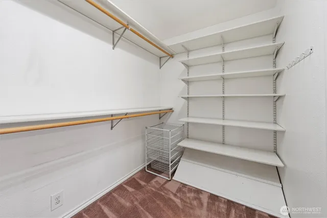 a view of an empty walk in closet