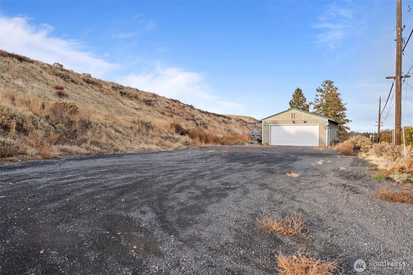 1411 D Street Southwest Ephrata, WA 98823 - Photo 39 of 39 a view of a dry yard with mountains in the background
