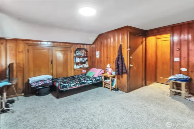 a bedroom with furniture and a window