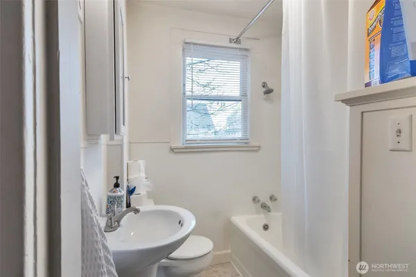 a bedroom with bed and a flat screen tv