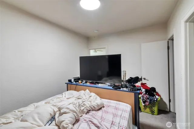 a living room with lots of furniture and a book shelf