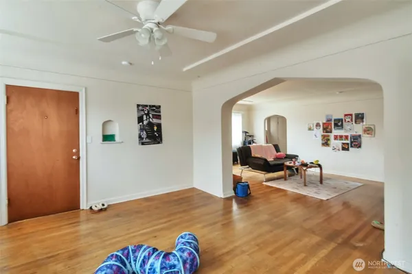 a kitchen with stainless steel appliances white cabinets and a refrigerator