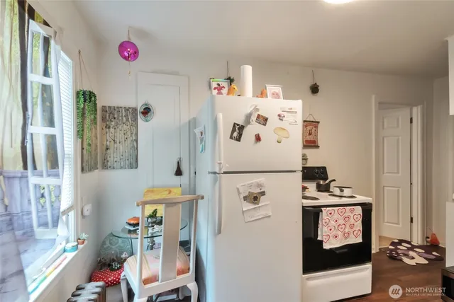a white refrigerator freezer sitting inside of a kitchen