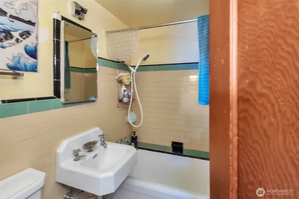 a bathroom with a sink and shower