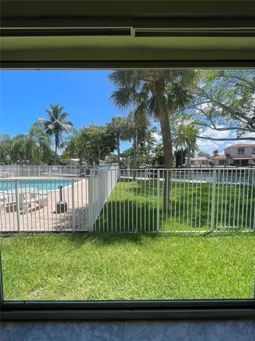 a view of a backyard with a garden and plants