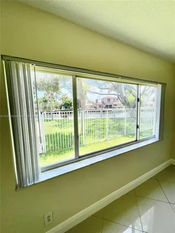 a view of a room with a large window