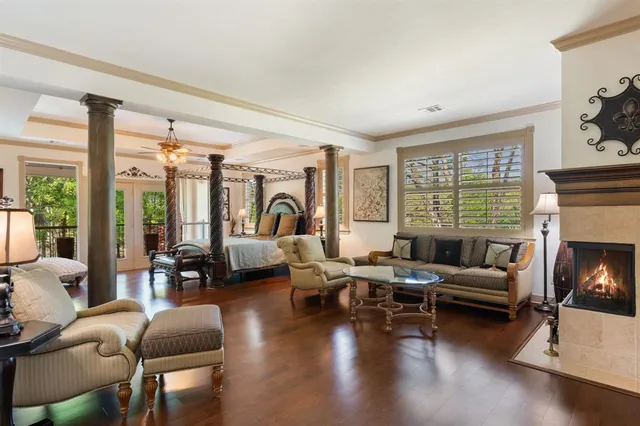a bedroom with furniture and wooden floor