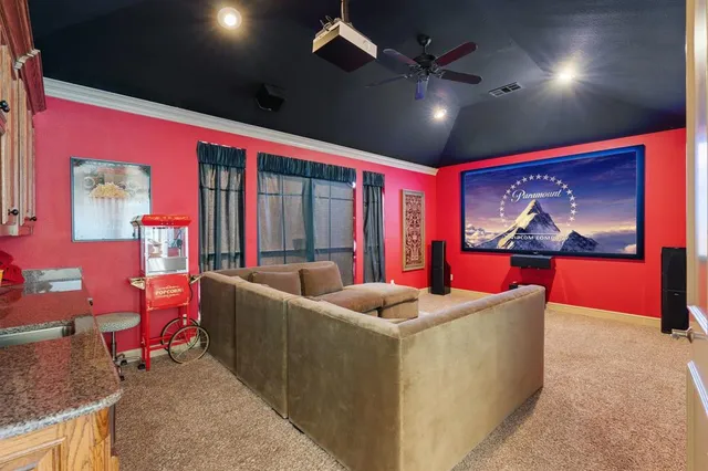 a room with furniture pool table wooden floor and windows