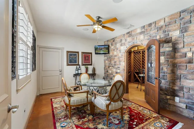 a living room with furniture a rug and a projector