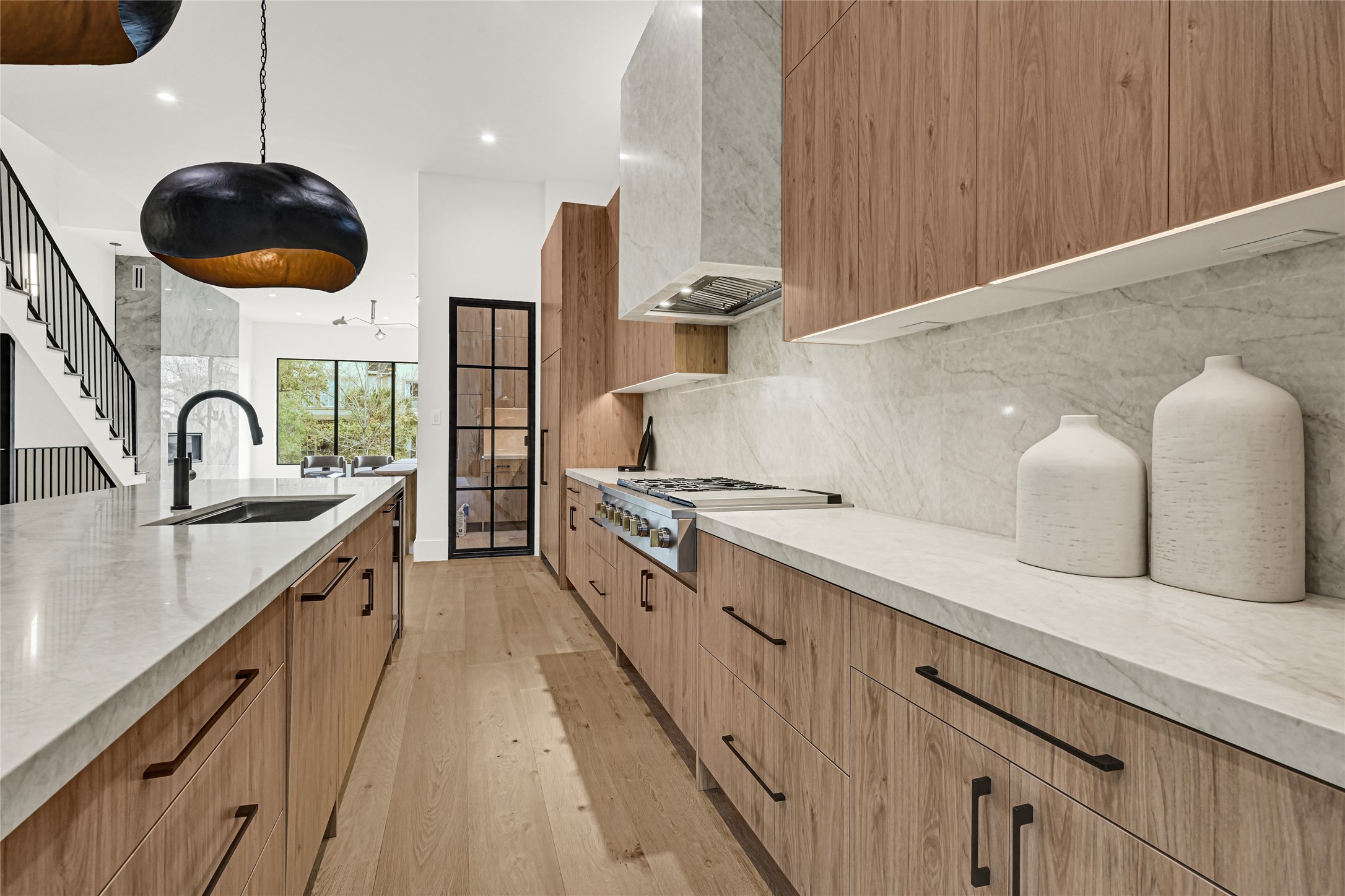 6405 Rodrigo Street, Unit A Houston, TX 77007 - Photo 11 of 28 a large kitchen with a large counter space a sink and stainless steel appliances