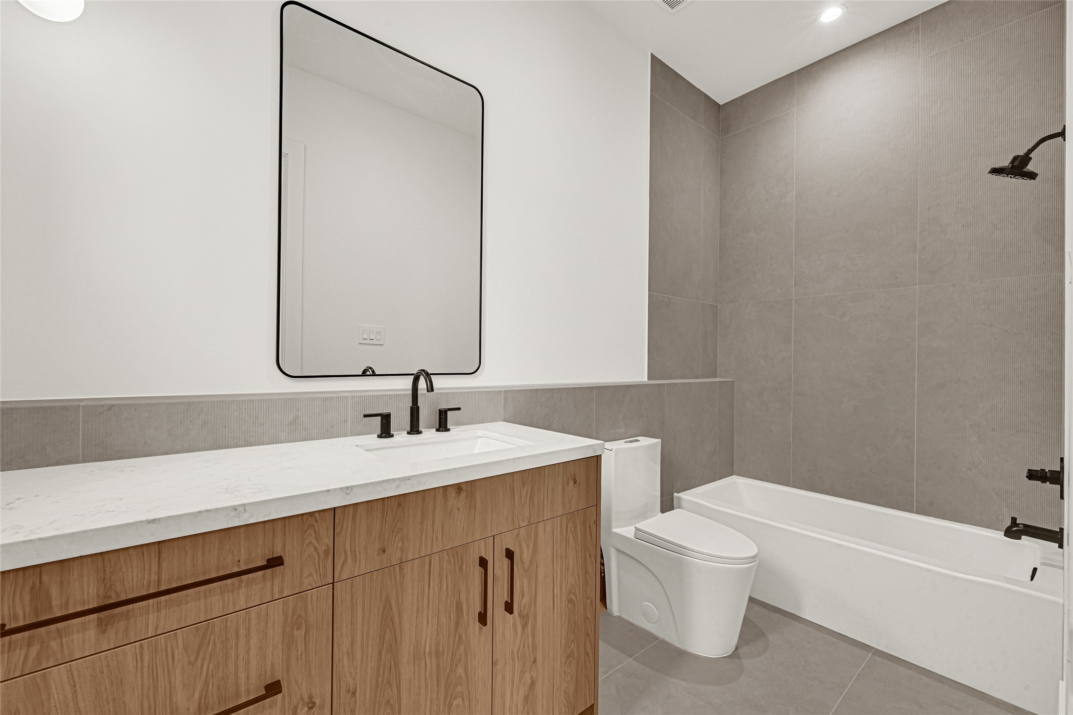 6405 Rodrigo Street, Unit A Houston, TX 77007 - Photo 19 of 28 a bathroom with a sink a toilet and a mirror