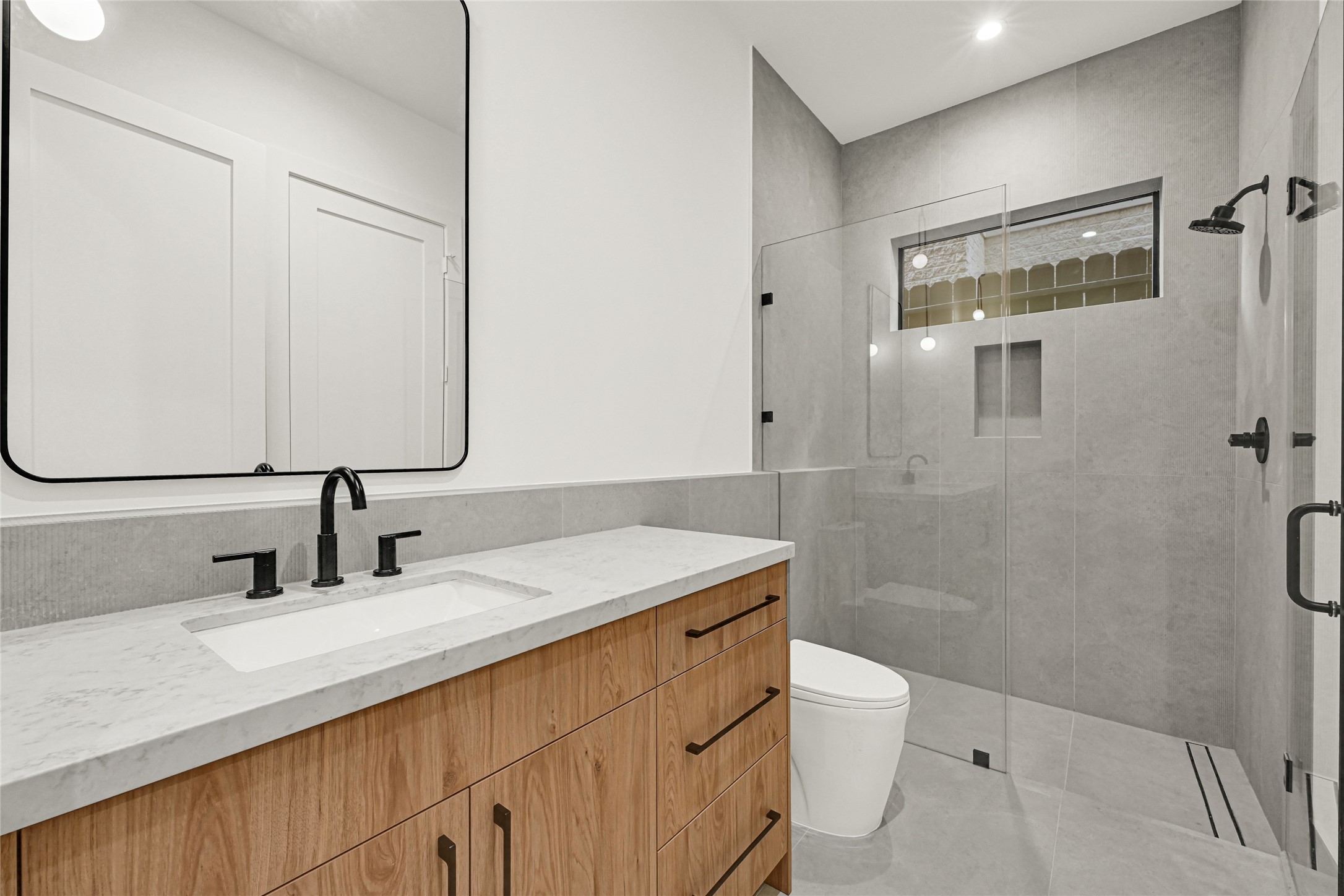 6405 Rodrigo Street, Unit A Houston, TX 77007 - Photo 6 of 28 a bathroom with a sink toilet double vanity and shower