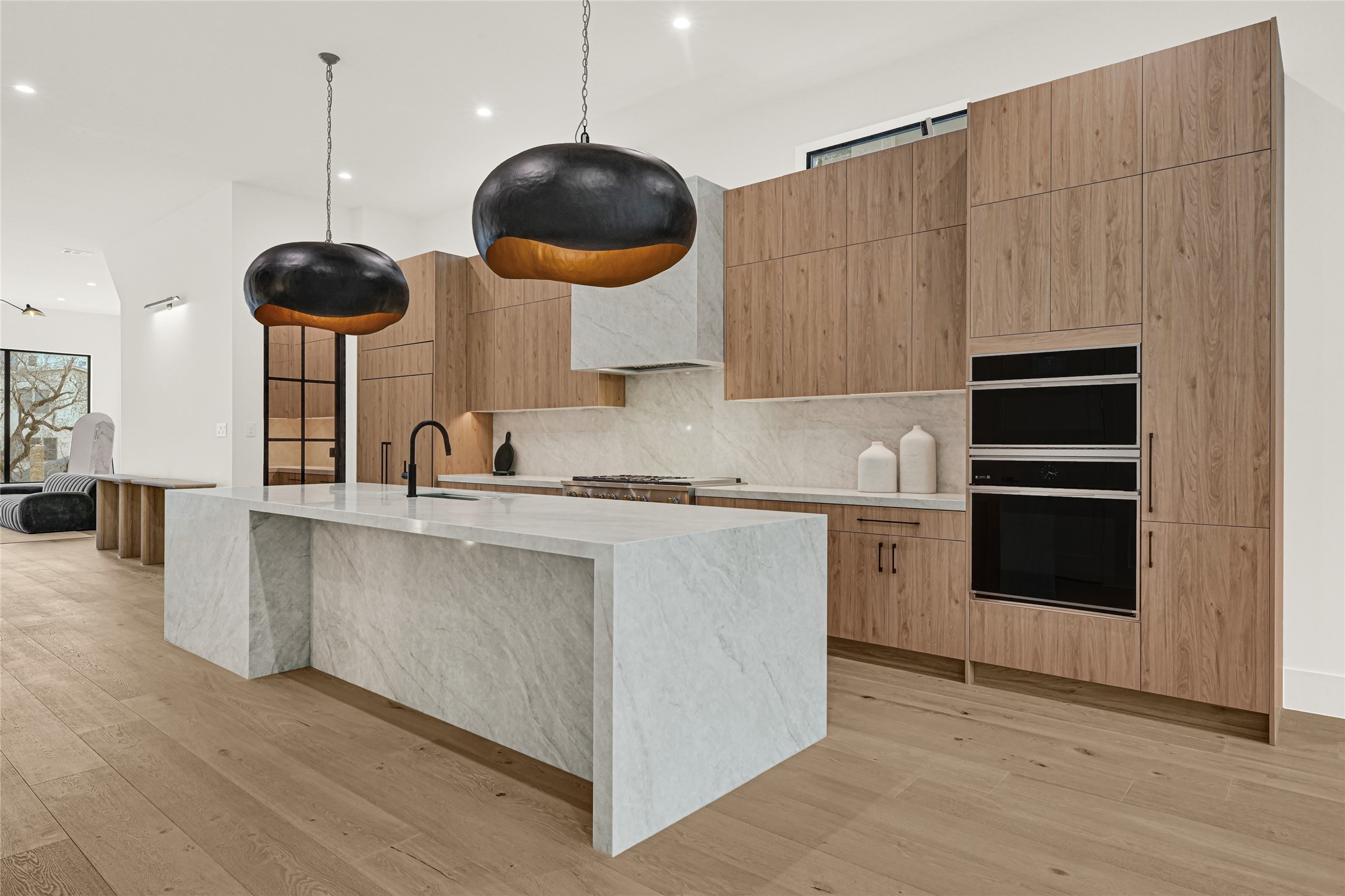 6405 Rodrigo Street, Unit A Houston, TX 77007 - Photo 10 of 28 a kitchen with stainless steel appliances a stove a microwave a sink a dining table and chairs