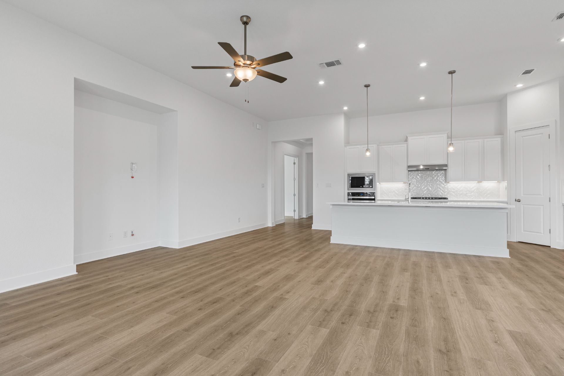 1405 Blue Moon Drive Georgetown, TX 78628 - Photo 12 of 33 From Family Room to Open Concept Kitchen