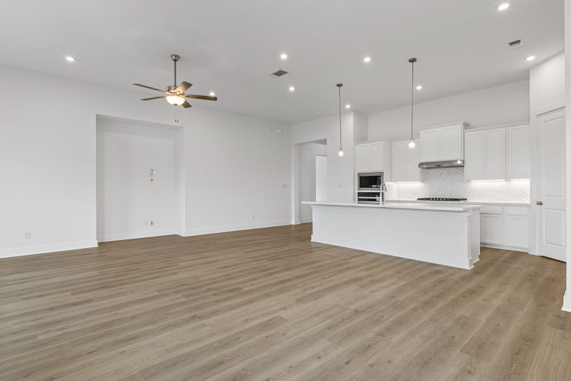1405 Blue Moon Drive Georgetown, TX 78628 - Photo 13 of 33 From Family Room to Open Concept Kitchen