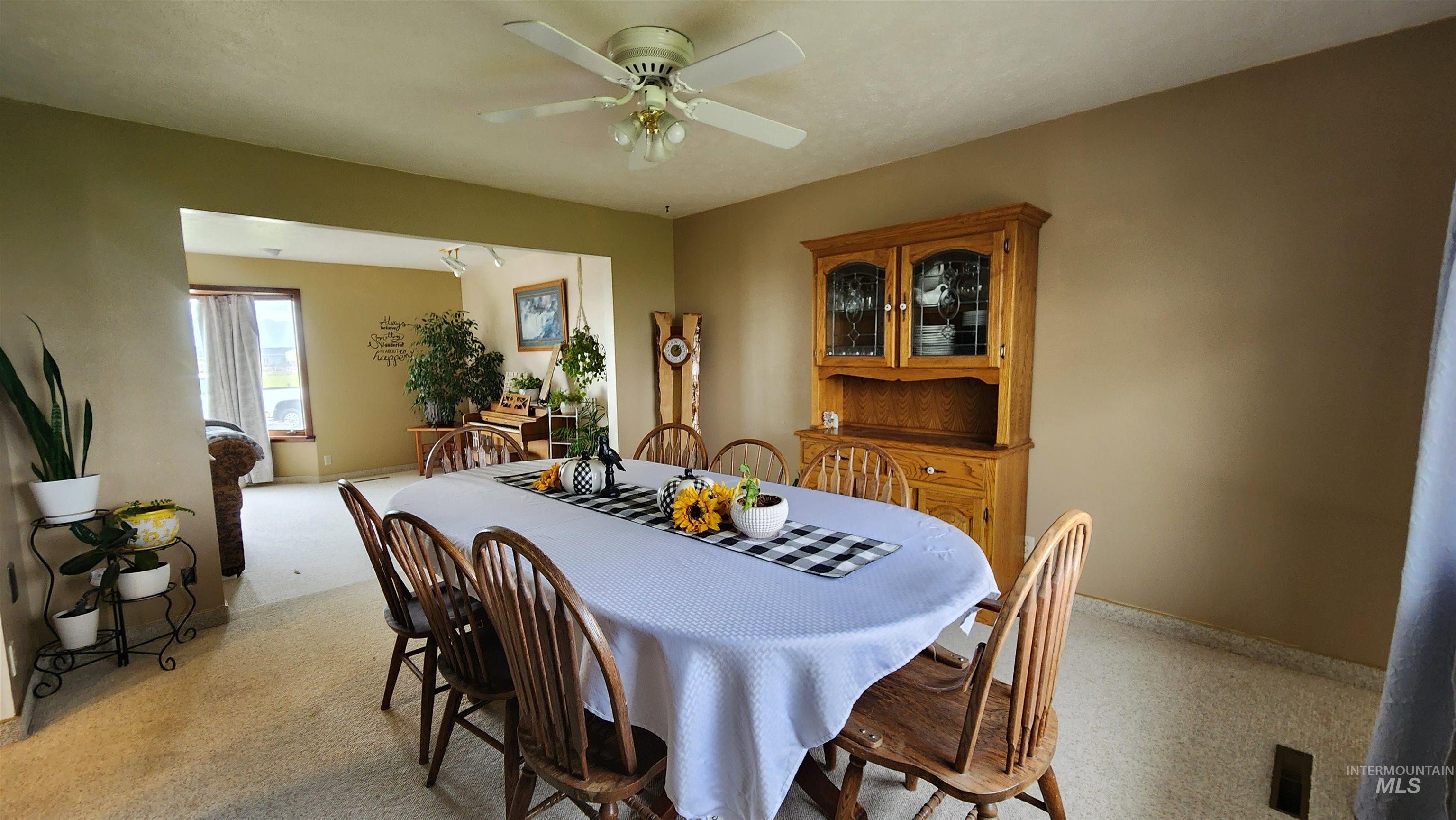 288 South 123 West Burley, ID 83318 - Photo 11 of 36 Formal Dining area with light colored carpet and a ceiling fan