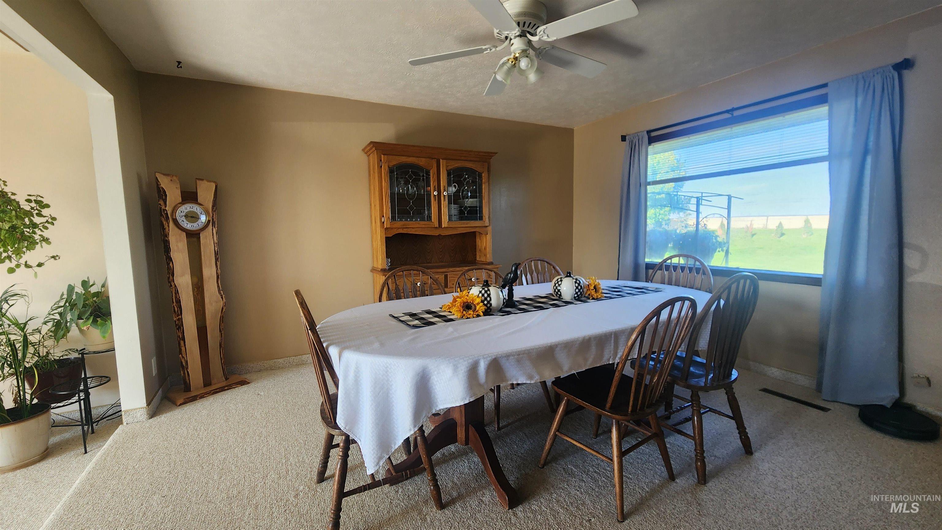 288 South 123 West Burley, ID 83318 - Photo 13 of 36 Dining room with light carpet and ceiling fan