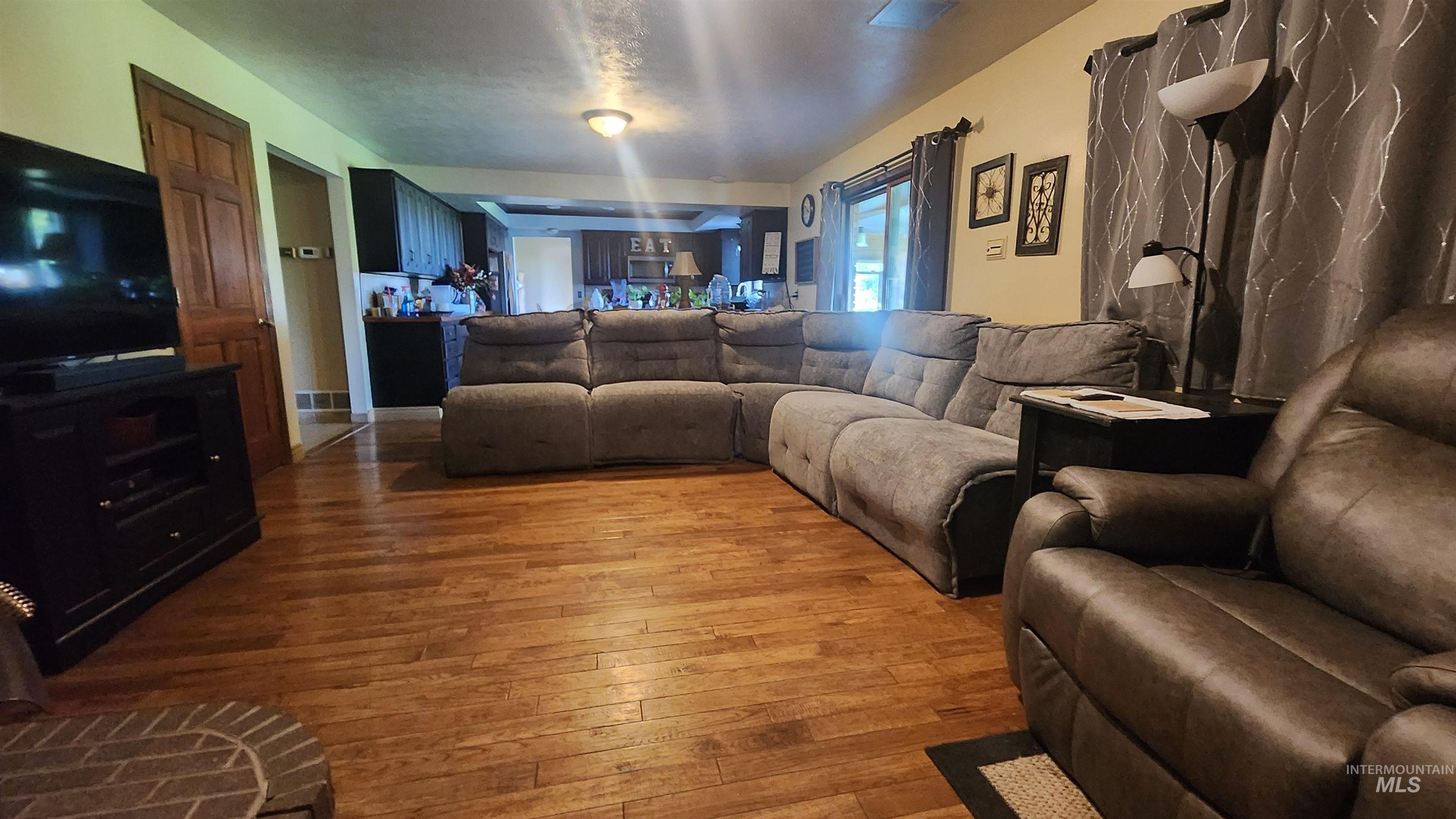 288 South 123 West Burley, ID 83318 - Photo 14 of 36 Living area with hardwood / wood-style floors