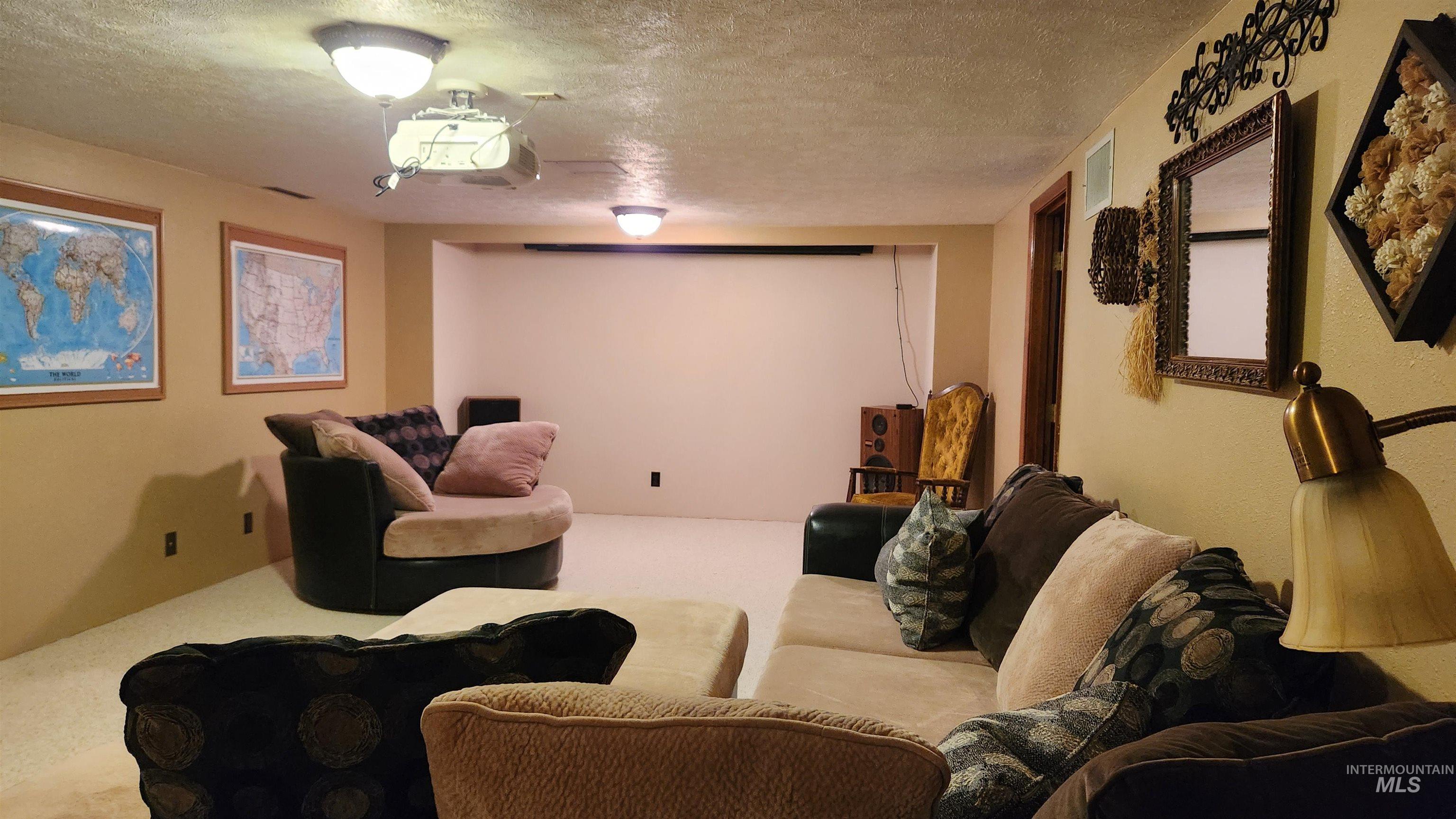 288 South 123 West Burley, ID 83318 - Photo 34 of 36 Cinema room with a textured ceiling and carpet floors