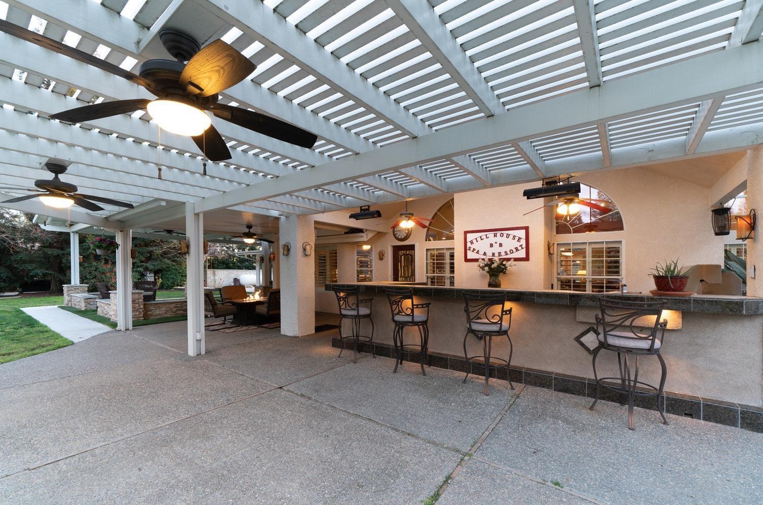 1290 North Applegate Avenue Fresno, CA 93737 - Photo 38 of 65 a view of a chairs and table in a patio
