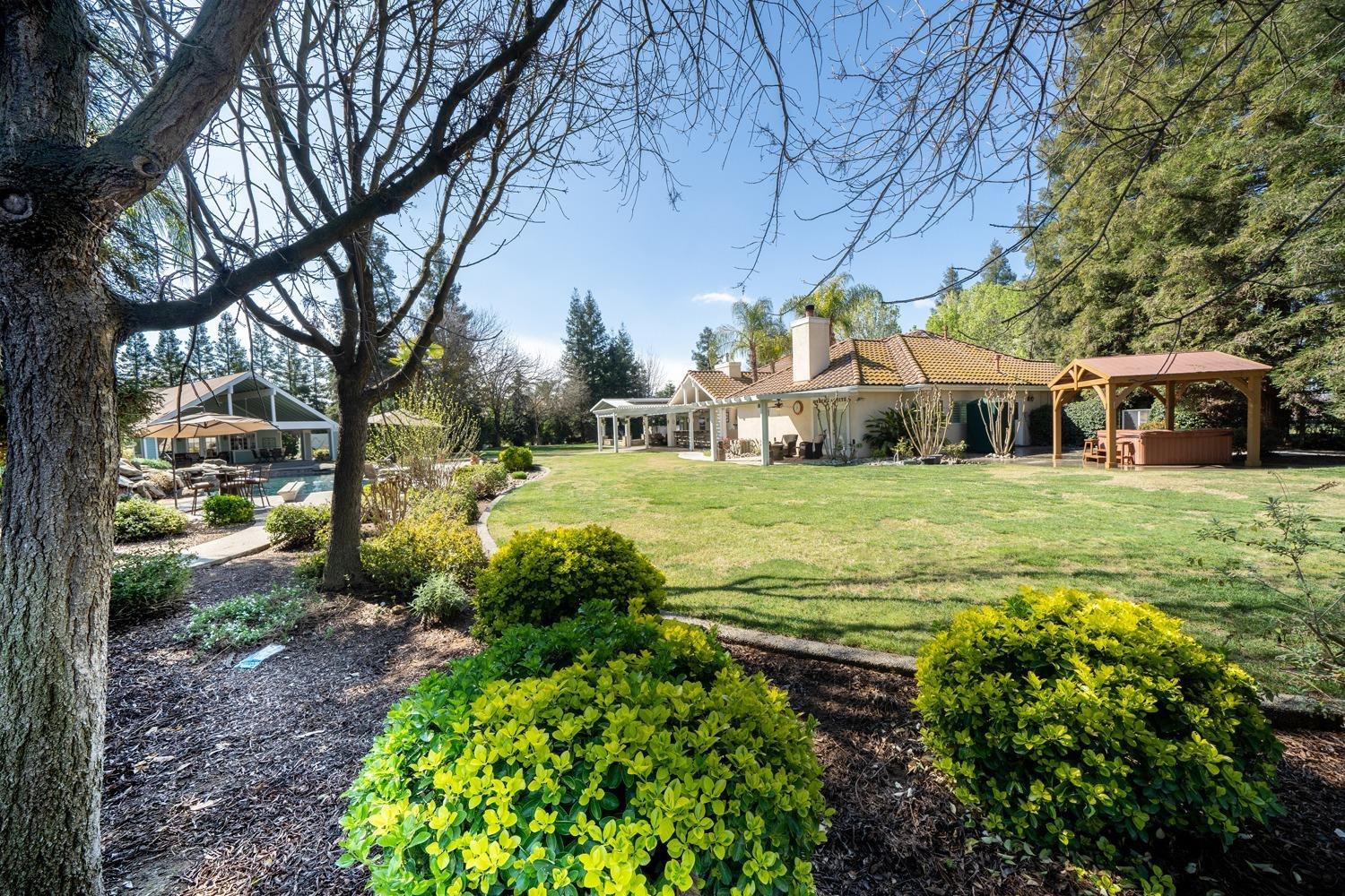 1290 North Applegate Avenue Fresno, CA 93737 - Photo 47 of 65 a view of a house with a yard