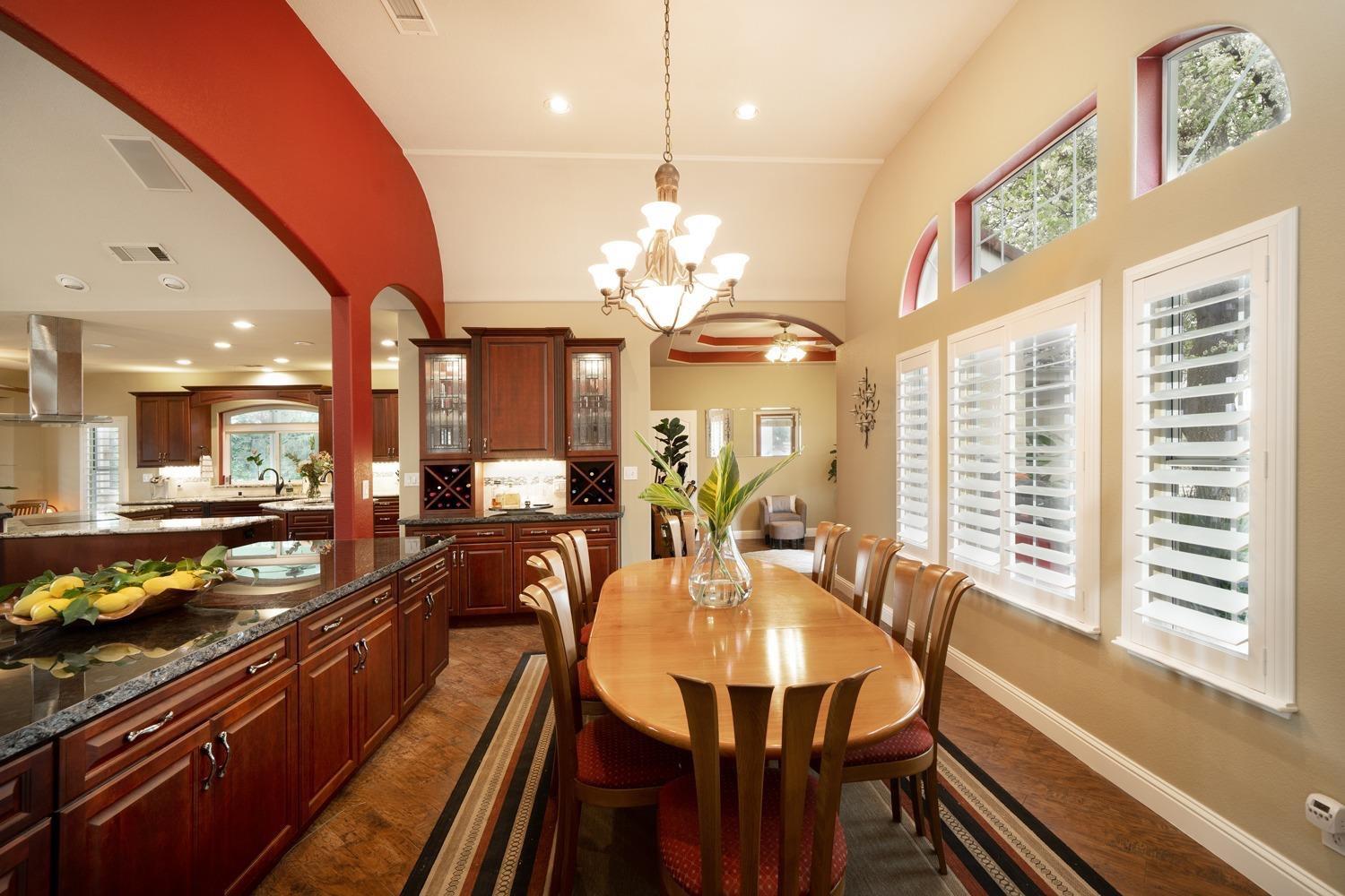 1290 North Applegate Avenue Fresno, CA 93737 - Photo 5 of 65 a large kitchen with a table and chairs