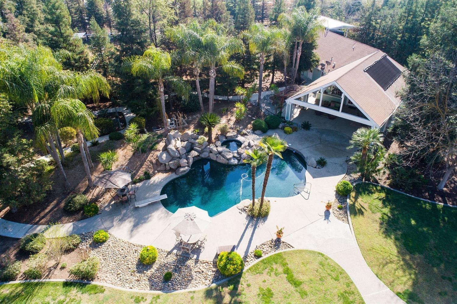 1290 North Applegate Avenue Fresno, CA 93737 - Photo 52 of 65 an aerial view of a house with a yard and a garden
