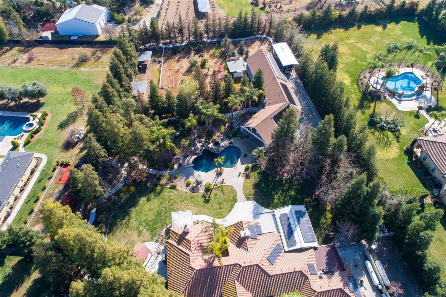 1290 North Applegate Avenue Fresno, CA 93737 - Photo 53 of 65 an aerial view of residential house with outdoor space and swimming pool