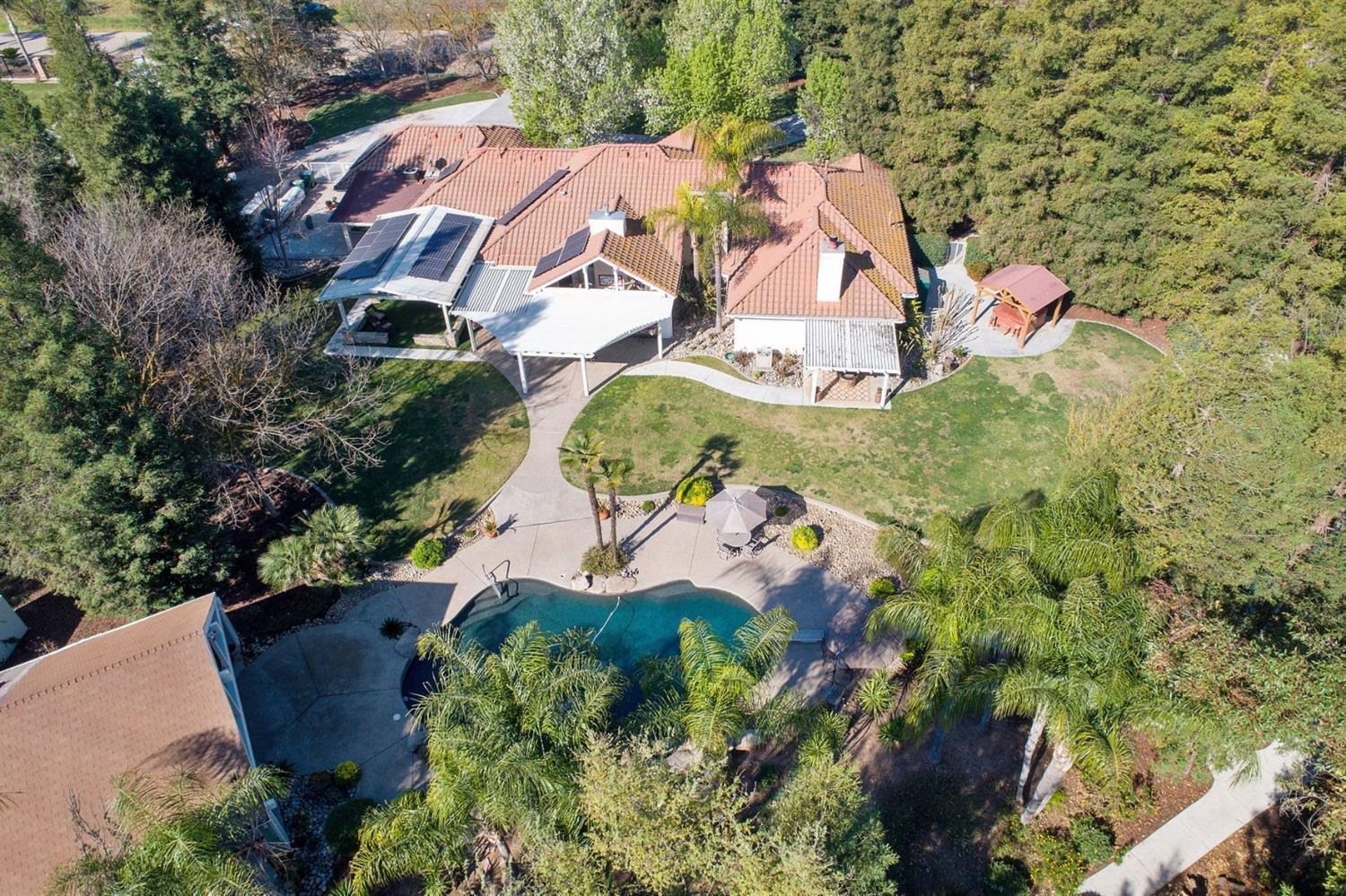 1290 North Applegate Avenue Fresno, CA 93737 - Photo 54 of 65 an aerial view of residential house with outdoor space and swimming pool