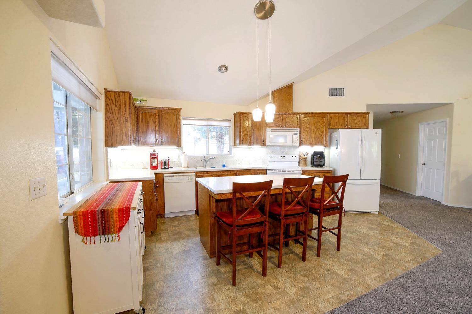 1290 North Applegate Avenue Fresno, CA 93737 - Photo 59 of 65 a dining room with a sink and a refrigerator