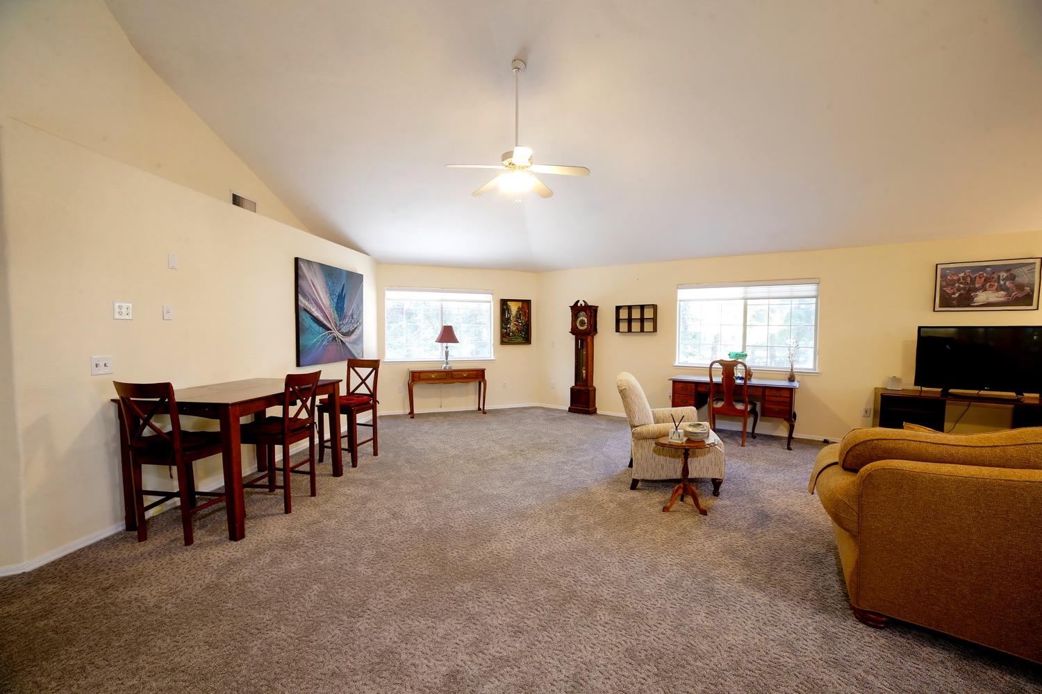 1290 North Applegate Avenue Fresno, CA 93737 - Photo 61 of 65 a living room with furniture and a flat screen tv