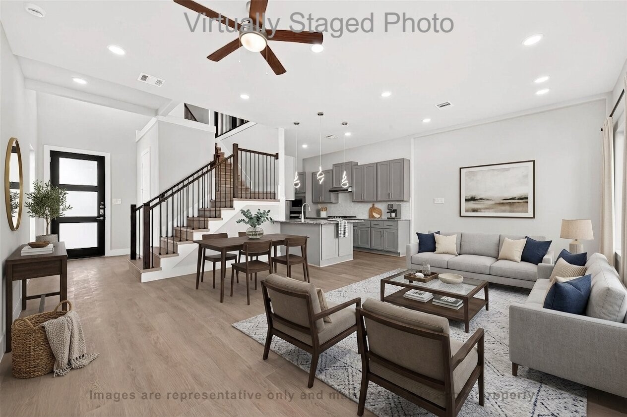 10719 Mason Road, Unit 39 Richmond, TX 77406 - Photo 5 of 50 Virtual Staging - Open-concept living area featuring a gray sectional sofa, an adjacent dining space, and a seamless flow into a modern kitchen_