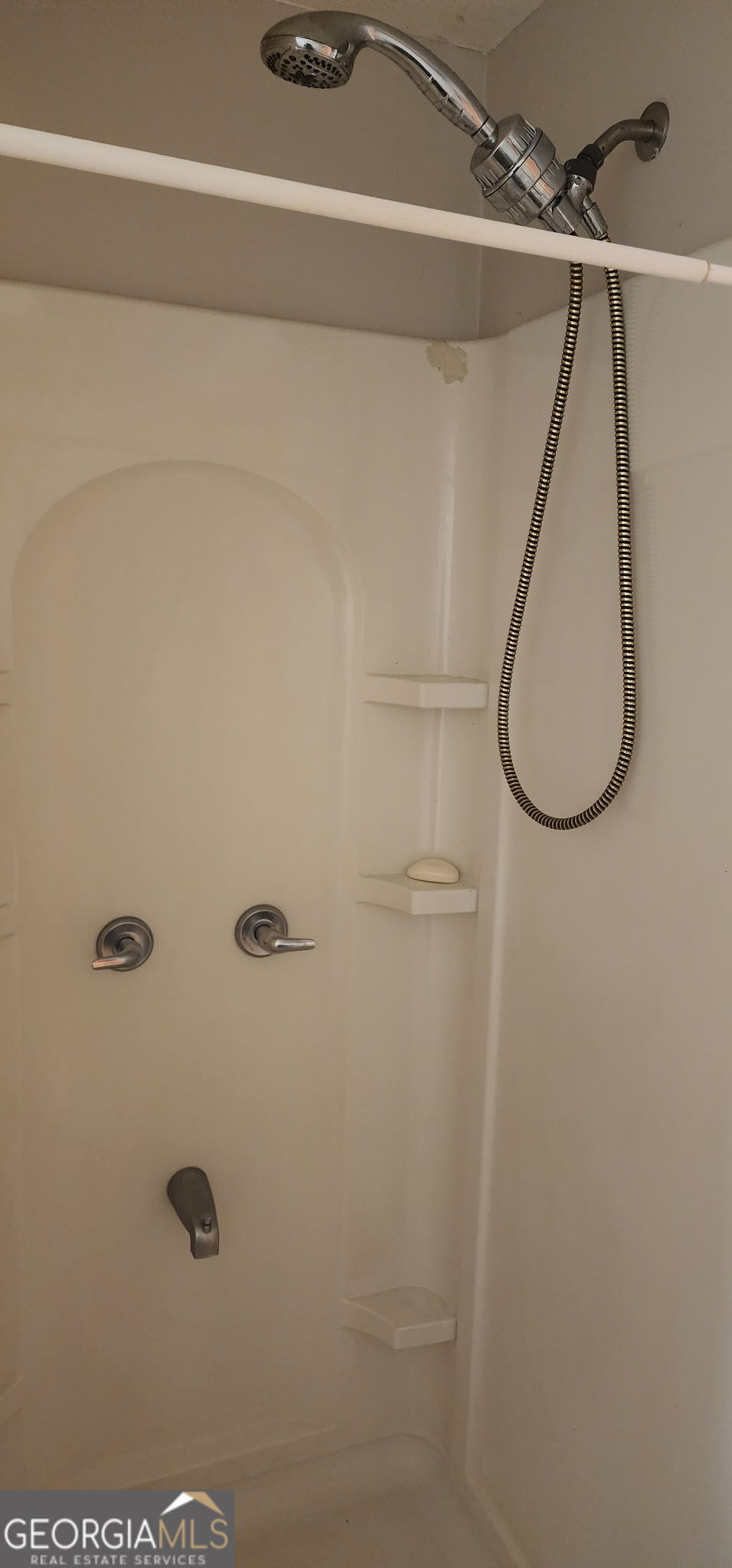 4778 Devon Way Stone Mountain, GA 30088 - Photo 3 of 4 a bathroom with a shower and a mirror