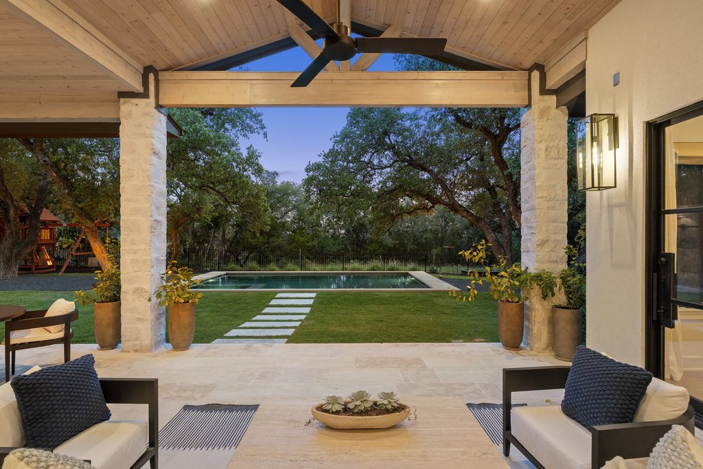 7516 Davenport Divide Road Austin, TX 78738 - Photo 35 of 40 The patio is perfectly sized for two distinct zones—a cozy outdoor lounge and a separate al fresco dining area.