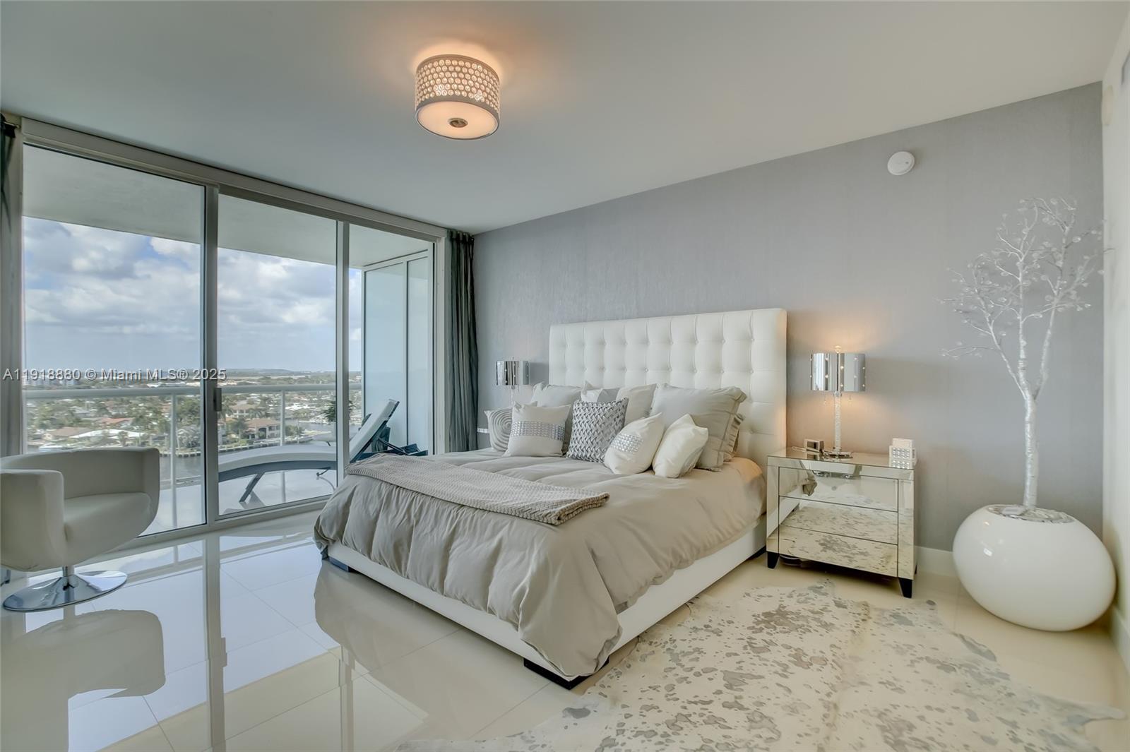 1 North Ocean Boulevard, Unit 1011 Pompano Beach, FL 33062 - Photo 13 of 48 a bedroom with a bed and a large window